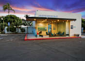 Thumbnail 203 of 208 - The Waterfront building has a red awning and a blue sign.