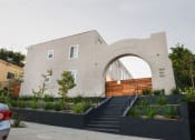 Thumbnail 10 of 10 - a building with an arch and stairs in front of it