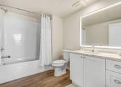 Thumbnail 15 of 50 - Wood plank-style flooring in bathrooms