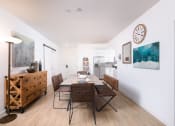 Thumbnail 17 of 50 - Wood plank-style flooring in living room, kitchen, and bathrooms