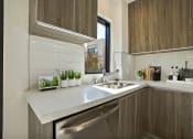 Thumbnail 13 of 59 - a kitchen with a sink and a window