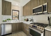 Thumbnail 12 of 59 - a kitchen with stainless steel appliances and wooden cabinets