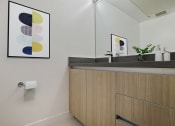 Thumbnail 10 of 59 - a bathroom with a sink and a mirror