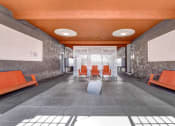 Thumbnail 4 of 27 - a long corridor with gray walls and an orange ceiling