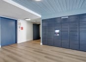 Thumbnail 8 of 24 - a row of lockers in a room with a blue ceiling