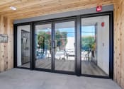 Thumbnail 6 of 24 - a sliding glass door in a wooden building
