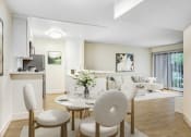 Thumbnail 3 of 24 - a living room and dining room with a table and chairs