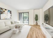 Thumbnail 2 of 24 - a living room with a couch and a coffee table