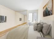 Thumbnail 15 of 24 - the master bedroom has a large bed and a tv in the corner