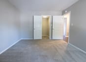 Thumbnail 58 of 63 - Primary Bedroom with a Walk-in Closet in the Two Bedroom One Bath Apartment at Woodbridge Apartments Bloomington