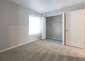 Thumbnail 57 of 63 - Second Bedroom with Closet in the Two Bedroom One Bath Apartment at Woodbridge Apartments Bloomington