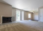 Thumbnail 61 of 63 - Open Living and Dining Room with Patio Access in the Two Bedroom One Bath Apartment  at Woodbridge Apartments Bloomington