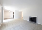 Thumbnail 55 of 63 - Open Dining and Living Room with a Fireplace in the Two Bedroom Two Bath Apartment at Woodbridge Apartments Bloomington