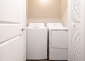 Thumbnail 49 of 63 - Laundry Area in the Two Bedroom Townhome at Woodbridge Apartments Bloomington