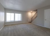 Thumbnail 51 of 63 - Spacious Living Room in the Two Bedroom Townhome at Woodbridge Apartments Bloomington