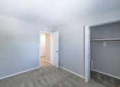 Thumbnail 36 of 63 - Second Bedroom with Ample Closet Space in the Three Bedroom Townhome at Woodbridge Apartments Bloomington