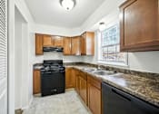 Thumbnail 7 of 16 - Kitchen in a 3-bedroom townhome at Ashton Pointe Apartments.