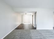 Thumbnail 43 of 63 - Dining Room with Patio Access and Living Room in the Three Bedroom Townhome at Woodbridge Apartments Bloomington