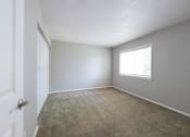 Thumbnail 37 of 63 - Primary Bedroom with a Large Window in the Three Bedroom Townhome at Woodbridge Apartments Bloomington