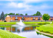 Thumbnail 9 of 14 - Pond on the exterior of an apartment building at Addison on Main