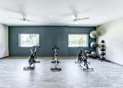 Thumbnail 25 of 39 - Fitness center at Woods of Fairfax, featuring stationary bicycles.