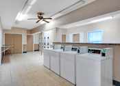 Thumbnail 8 of 17 - Apartment laundry facility at Mount Vernon with washers, dryers, and a clean, organized space for doing laundry.