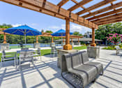 Thumbnail 30 of 39 - Outdoor pergola with seating at  Woods of Fairfax.