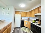 Thumbnail 1 of 17 - Kitchen and Breakfast Bar at Ashmore Trace Apartments