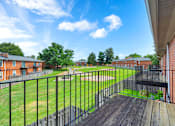 Thumbnail 7 of 17 - Balcony of a 1-bed, 1-bath apartment in Mount Vernon, featuring a railing and space for outdoor seating with views of the surrounding area.