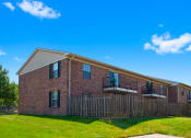 Thumbnail 10 of 16 - Balcony at Cambridge Square Apartments in Greenwood, with views of the surrounding landscape.