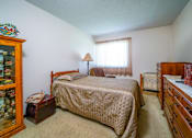 Thumbnail 2 of 15 - Bedroom in a 1-bed, 1-bath apartment at Wesley Park Apartments, featuring a spacious layout and large windows for natural light.