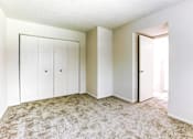 Thumbnail 4 of 18 - Bedroom with a closet at Thompson Village Apartments, Indiana