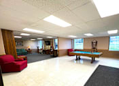 Thumbnail 7 of 17 - A spacious room with a pool table  at Kentwood Square Apartments.