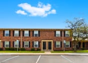 Thumbnail 13 of 18 - Exterior view of Briarwood Apartments in Lafayette, with parking spaces conveniently located in front.
