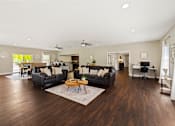 Thumbnail 17 of 24 - Clubhouse at Briarwood Apartments, Columbus, IN, offering a comfortable space for residents to relax.