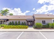 Thumbnail 4 of 23 - Exterior of the clubhouse and leasing center at Woodbridge Apartments