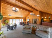 Thumbnail 6 of 23 - Clubhouse with a full kitchen and an entertainment area with ample seating at Woodbridge Apartments