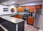 Thumbnail 14 of 63 - Clubhouse kitchen at Woodbridge Apartments Bloomington.