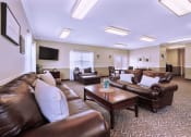 Thumbnail 5 of 16 - Clubhouse lounge at Cambridge Square Apartments in Greenwood, with comfortable seating for residents to enjoy.