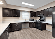 Thumbnail 15 of 19 - Community room kitchen at Briarwood Apartments in Lexington.