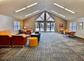 Thumbnail 11 of 16 - Comfortable seating area in the community room  at Copper Gate, Lafayette, 47909