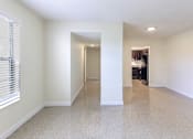 Thumbnail 2 of 16 - Corridor in a 2-bed, 1-bath apartment at Cambridge Square Apartments in Lauderdale Lakes, providing access to other rooms..