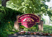 Thumbnail 63 of 63 - Exterior Sign at Woodbridge Apartments Bloomington