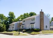 Thumbnail 20 of 63 - Exterior Townhome Building at Woodbridge Apartments Bloomington