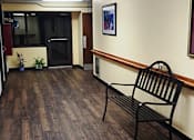 Thumbnail 5 of 13 - Interior common space at Marshall House Apartments with bench seating.