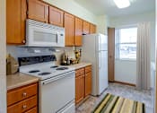 Thumbnail 1 of 16 - Kitchen with a stove, microwave, and refrigerator  at Copper Gate, Lafayette, 47909