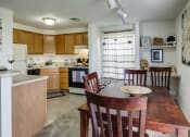 Thumbnail 5 of 19 - Kitchen and Dining Room with Built in Desk at Ashmore Trace
