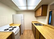 Thumbnail 1 of 17 - Kitchen in a one-bedroom, one-bathroom apartment at Kentwood Square Apartments.