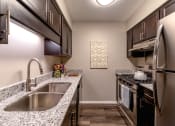 Thumbnail 1 of 63 - Full Kitchen at Woodbridge Apartments Bloomington