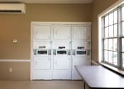 Thumbnail 9 of 16 - Laundry Center at Williamsburg on the Lake